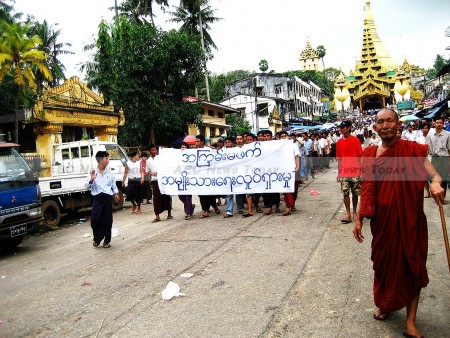 Protesters marched around Yangon with a banner that reads “non-violence: national movement in Burmese.”