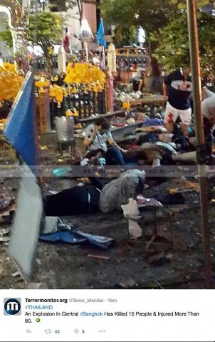 People lay on the ground outside Erawan Shrine following Monday night's Bangkok bomb