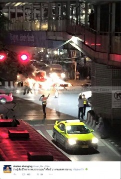 Vehicles burn at the Ratchaprasong intersection near Erawan shrine following the Bangkok bomb blast