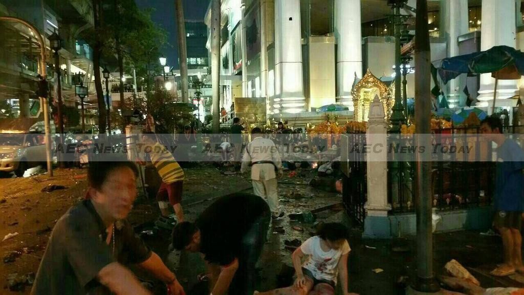People lie dazed on the ground in front of Erawan shrine following the Bangkok bomb blast Monday evening