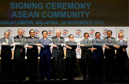 The head's of State of Asean's 10 member countries links hands after signing the 2015 Kuala Lumpur Declaration on the Establishment of the Asean Community