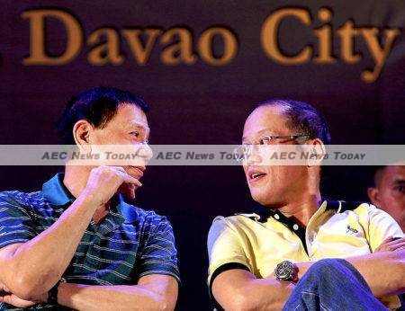 Philippines president-elect Rodrigo Duterte chats with outgoing President Benigno Aquino III in this March 6, 2013 photo