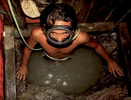Compressor mining in the Philippine mining sector. The most dangerous style of mining globally, miners stay 12 metres (40ft) underwater for up to two hours at a time in "trash can size shafts".