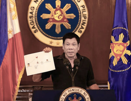 Philippine President Rodrigo Duterte presents a chart claimed to be illustrating a drug trade network of high level drug syndicates in the Philippines on July 7, 2016