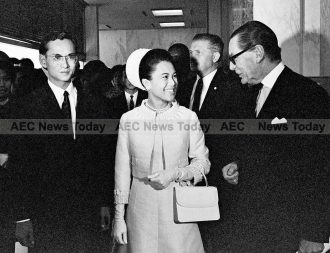 Their Majesties King Bhumibol Adulyadej and Queen Sirikit of Thailand in the Secretariat Lobby with Mr. Pierre de Neulemeester (right), Chief of Protocol of the UN, 09 June 1967.