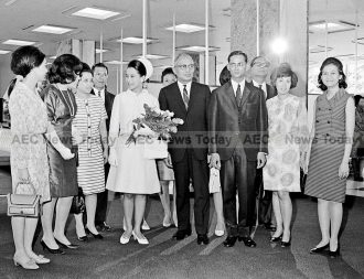 Their Majesties King Bhumibol Adulyadej and Queen Sirikit of Thailand with Thai members of the United Nations Secretariat. At centre is Secretary-General U Thant, 09 June 1967.
