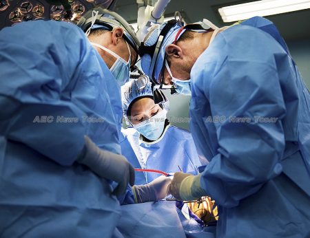 Dr Khairul Bariah (center), an oral maxillofacial surgeon from Hospital Tengku Ampuan Afzan performs surgery on a patient with the assistance of US Air Force Lieutenant. Col. Jeffrey Healy and US Navy Captain Craig Salt, both plastic surgeons assigned to USNS Mercy (T-AH 19)