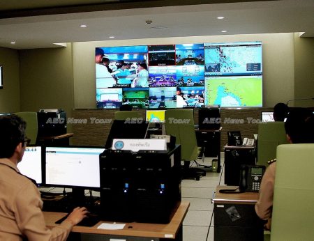 Staff at the Command Center to Combat Illegal Fishing (CCCIF) watch a boarding party on part of the screen, while monitoring Thailand fishing vessels in the Gulf of Thailand and the Andaman Sea