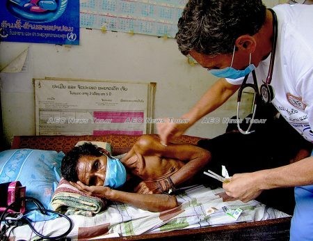 A doctor working with the Lao Rehabilitation Foundation treats a man in rural Lao