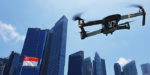 A drone flies over the Singapore city skyline.