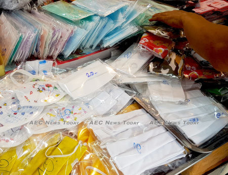 Face masks sell at inflated prices on the streets of Bangkok while hundreds of tonnes are exported