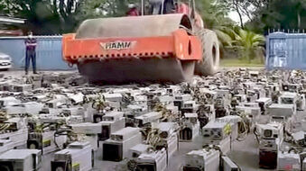 Malaysia crushes cryptocurrency mining rigs with road compactor for power theft (video)
