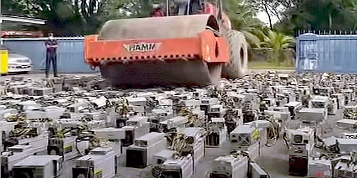 Malaysia crushes cryptocurrency mining rigs with road compactor